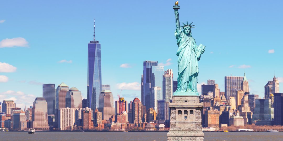 Statue of Liberty standing before the Lower Manhattan skyline