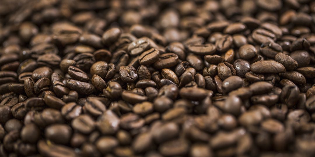 Close-up of a pile of roasted coffee beans.