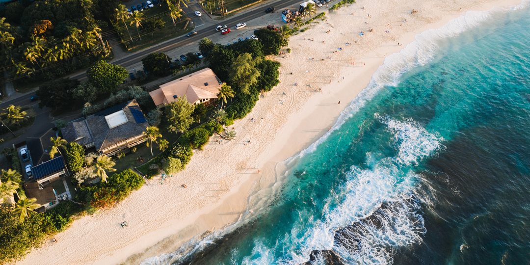 | Why Visit | why-visit-grenada.jpg | Beach Coastline (unclaimed) | Aerial view of a white sand beach meeting turquoise water