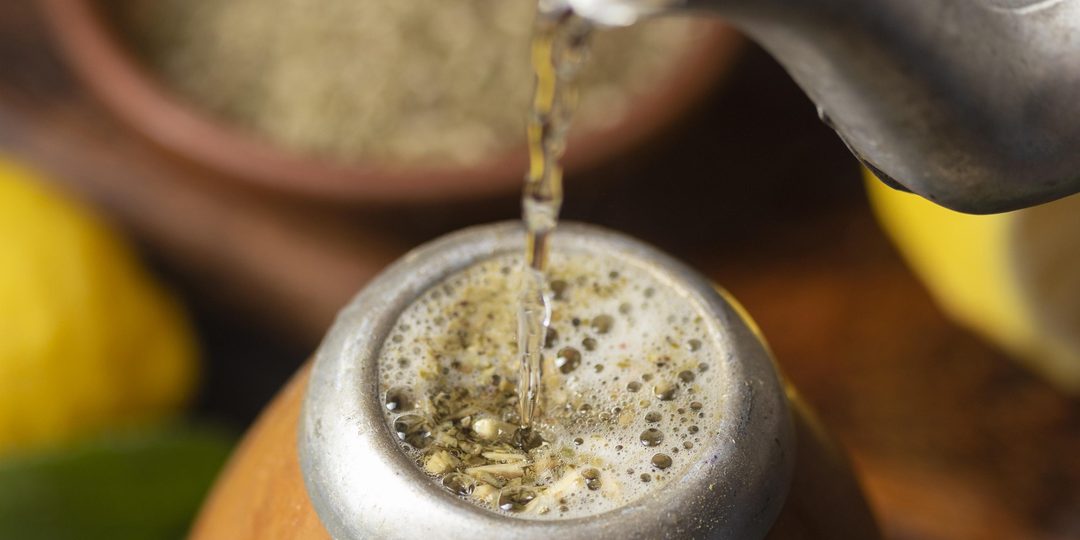 Traditional terere gourd and metal straw